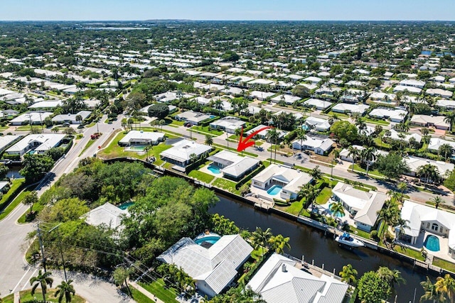 bird's eye view featuring a residential view and a water view