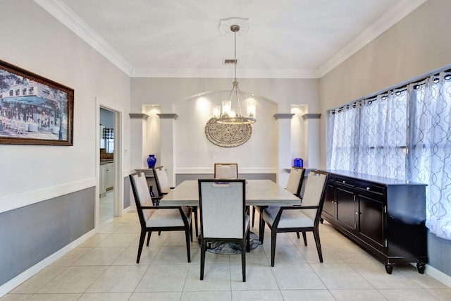 dining space featuring crown molding, light tile patterned floors, and a chandelier