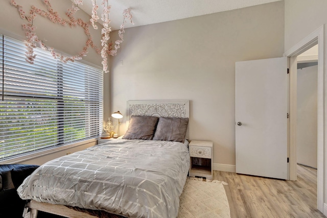 bedroom with light hardwood / wood-style flooring