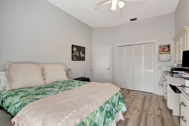 bedroom with light hardwood / wood-style floors and ceiling fan