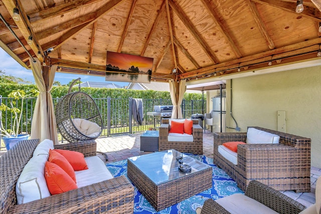 view of patio featuring an outdoor living space and a gazebo