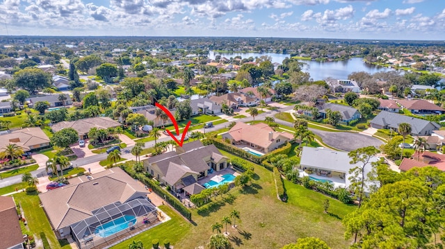 birds eye view of property featuring a water view