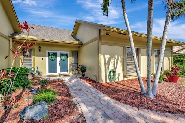 property entrance featuring french doors