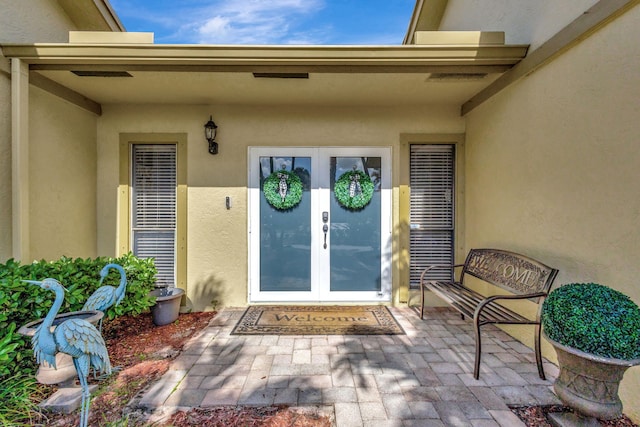 property entrance featuring french doors