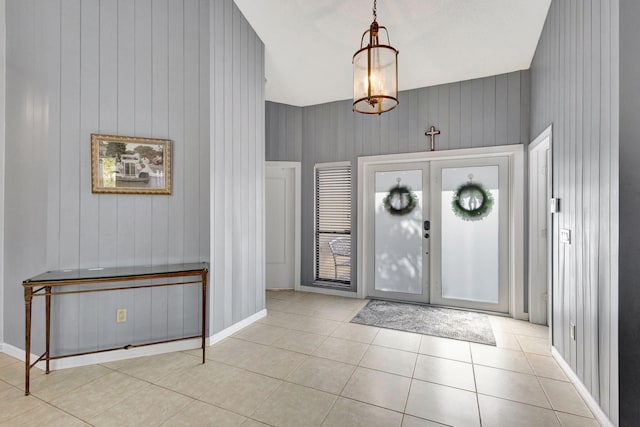 entryway featuring light tile patterned floors and french doors