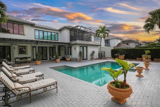 view of swimming pool with a fenced in pool and a patio area