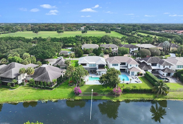 drone / aerial view with a residential view and a water view