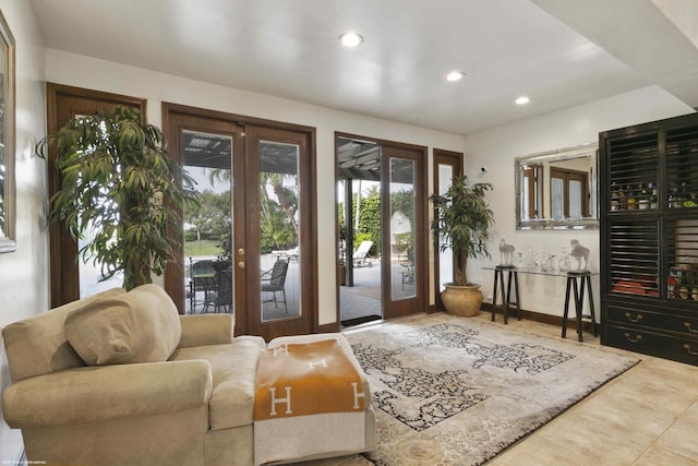 entryway featuring recessed lighting, french doors, and tile patterned floors