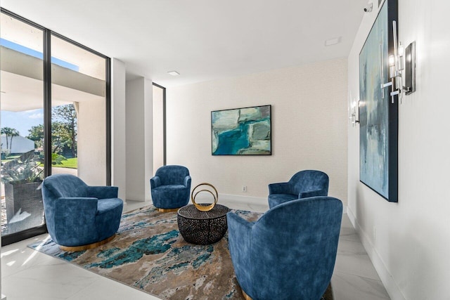 sitting room with floor to ceiling windows