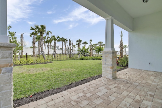 view of yard featuring a patio and fence