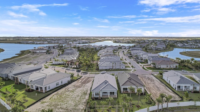 aerial view with a water view and a residential view