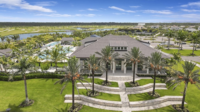 exterior space with a residential view and a water view