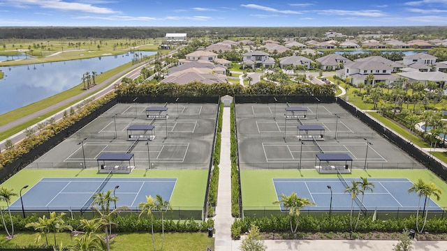 aerial view with a residential view and a water view