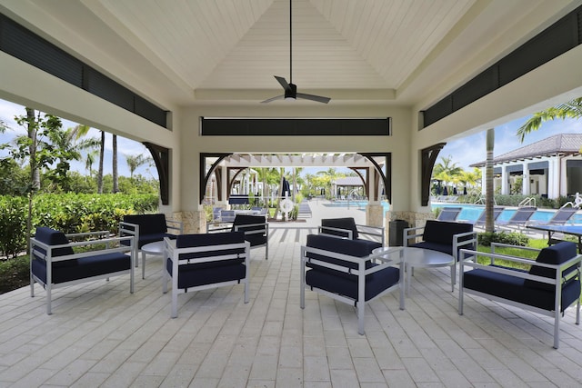 deck with an outdoor pool, an outdoor living space, and ceiling fan