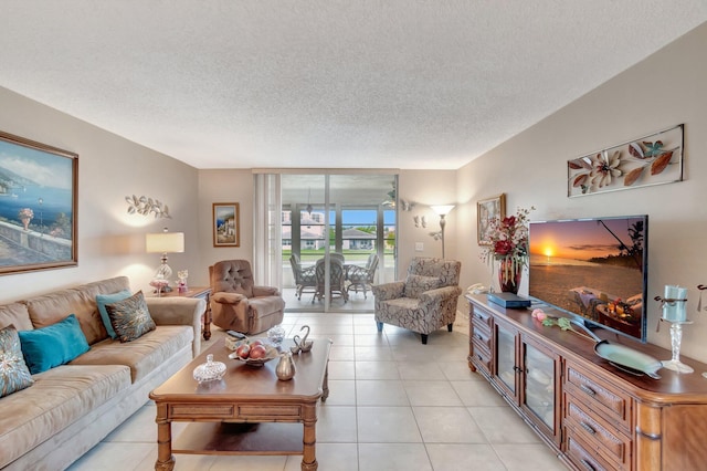 living room with a textured ceiling and light tile patterned floors