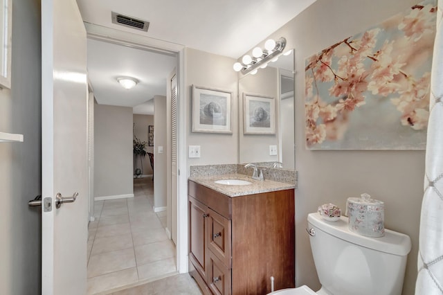 full bath featuring visible vents, toilet, vanity, baseboards, and tile patterned floors