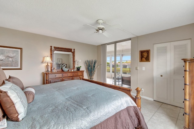 bedroom with light tile patterned floors, ceiling fan, access to outside, a textured ceiling, and a closet