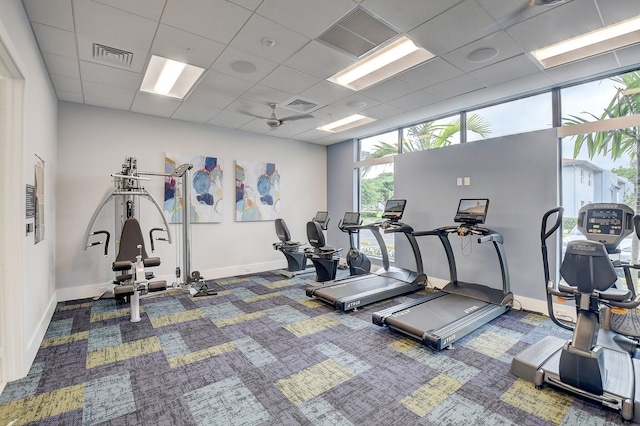 gym with a drop ceiling, carpet, and visible vents