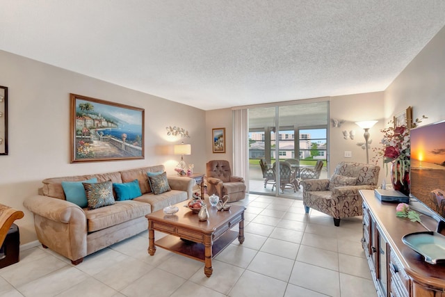 living area featuring a textured ceiling and light tile patterned flooring