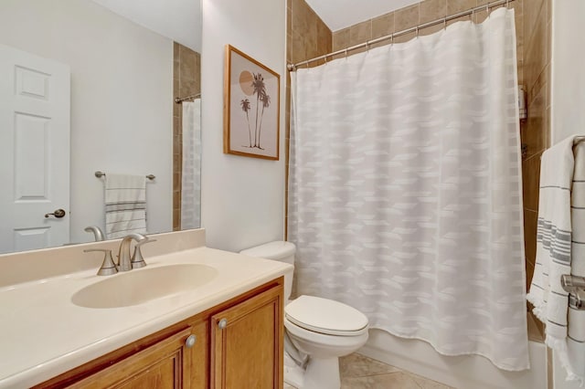 full bathroom with vanity, tile patterned floors, toilet, and shower / bath combo with shower curtain