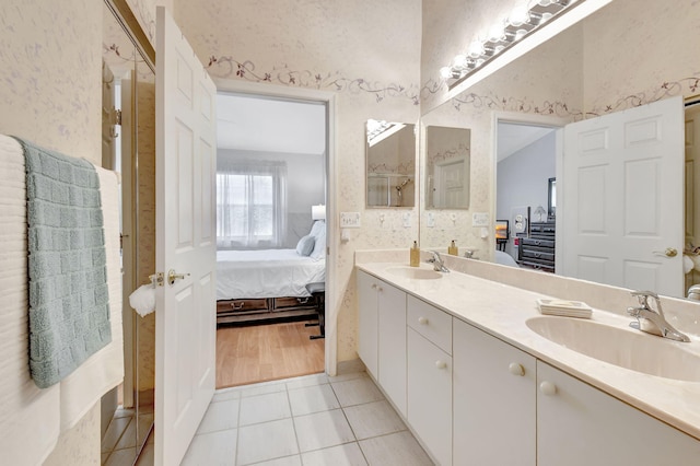 bathroom with tile patterned flooring and vanity