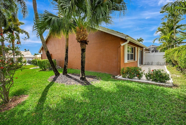 view of home's exterior with a lawn