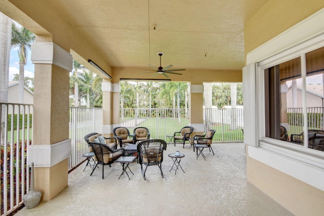 view of patio featuring an outdoor living space and ceiling fan