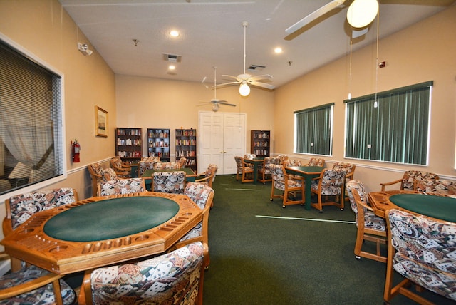 game room featuring vaulted ceiling, carpet flooring, and ceiling fan