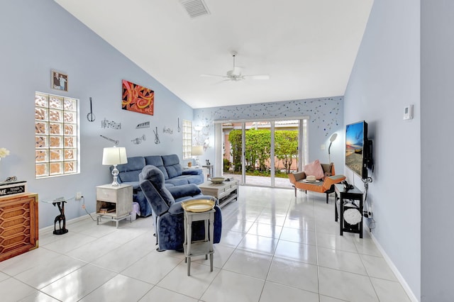 tiled living room with high vaulted ceiling and ceiling fan