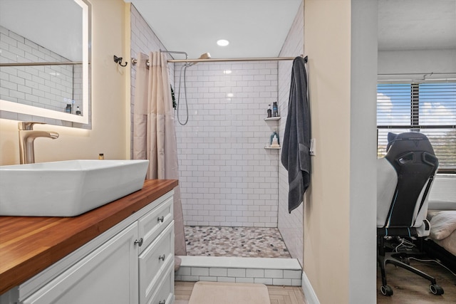 bathroom featuring vanity and a shower with shower curtain