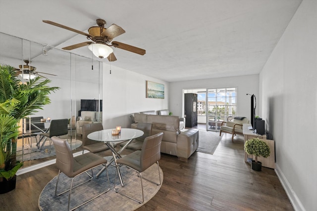 dining space with dark hardwood / wood-style flooring