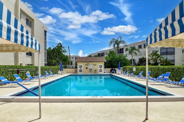 view of swimming pool featuring a patio area