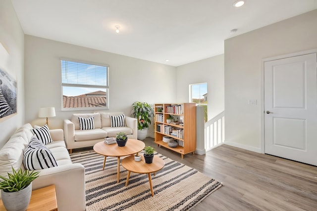12521 NW Lynch Ln, Port Saint Lucie, FL 34987 - living room with wood finished floors, baseboards, and recessed lighting