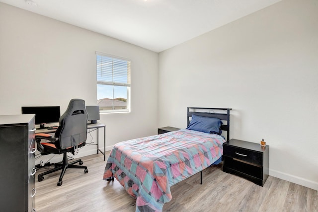 12521 NW Lynch Ln, Port Saint Lucie, FL 34987 - bedroom featuring light wood-style floors and baseboards
