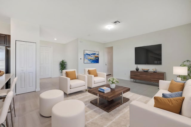 12521 NW Lynch Ln, Port Saint Lucie, FL 34987 - living area with light tile patterned floors, recessed lighting, baseboards, and visible vents