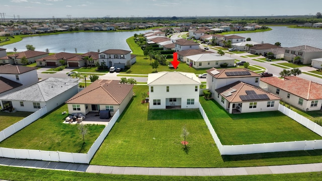 birds eye view of property with a residential view and a water view