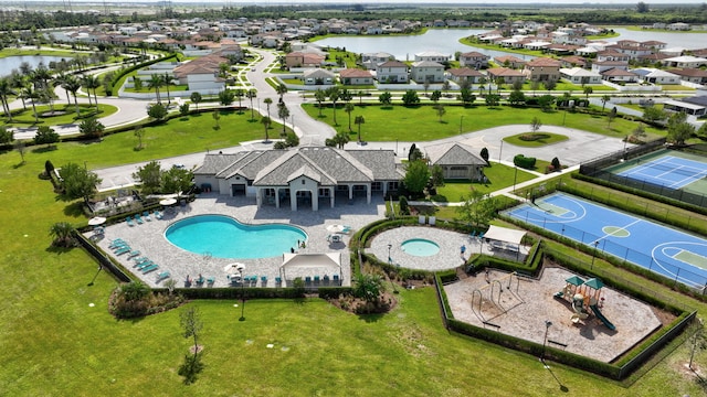 bird's eye view featuring a residential view and a water view