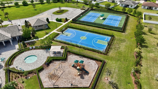 view of basketball court with community basketball court, playground community, a tennis court, and fence