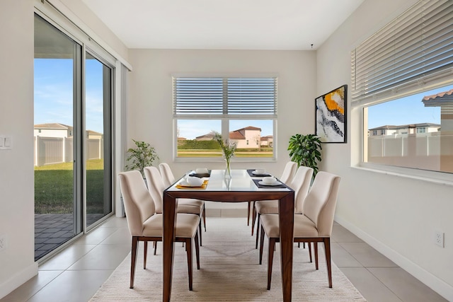 12521 NW Lynch Ln, Port Saint Lucie, FL 34987 - dining area featuring baseboards and light tile patterned flooring
