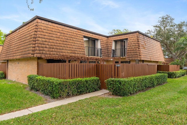 view of home's exterior with a lawn