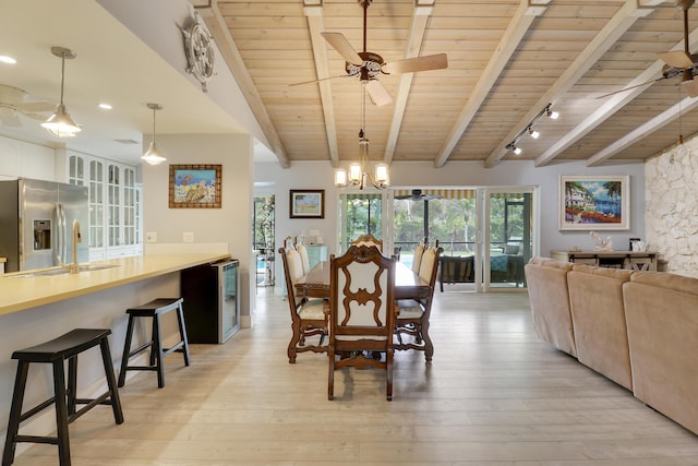 10174 Dogwood Ave, Palm Beach Gardens, FL 33410 - dining space with wooden ceiling, a ceiling fan, beam ceiling, light wood finished floors, and wine cooler