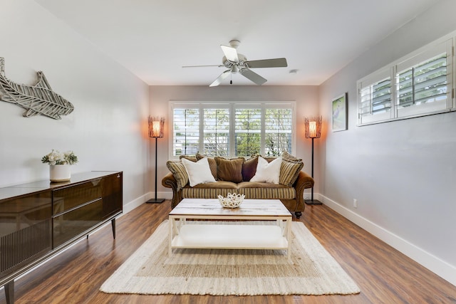 10174 Dogwood Ave, Palm Beach Gardens, FL 33410 - living room featuring ceiling fan, baseboards, and healthy amount of natural light