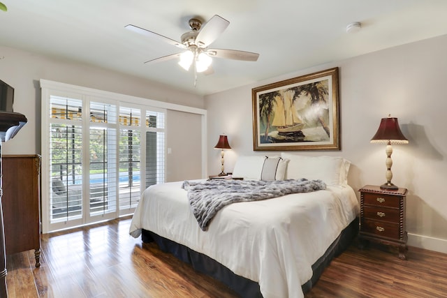 10174 Dogwood Ave, Palm Beach Gardens, FL 33410 - bedroom featuring dark wood finished floors, access to outside, a ceiling fan, and baseboards