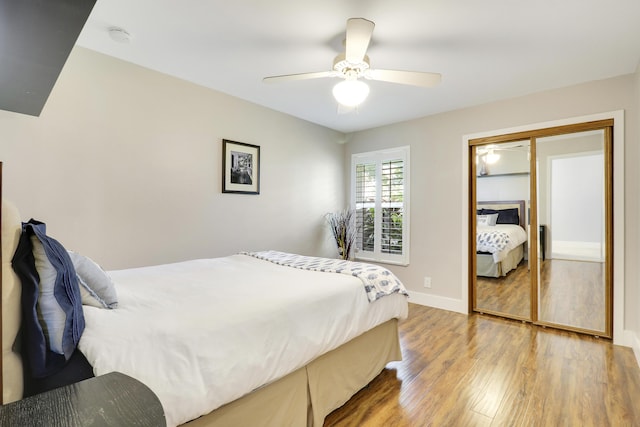 10174 Dogwood Ave, Palm Beach Gardens, FL 33410 - bedroom featuring wood finished floors, a ceiling fan, baseboards, and a closet