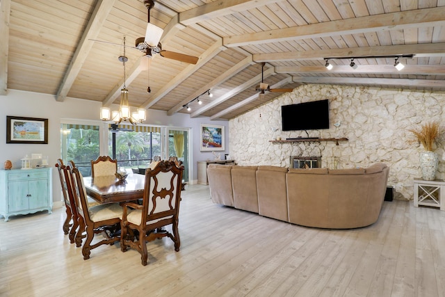 10174 Dogwood Ave, Palm Beach Gardens, FL 33410 - dining room featuring ceiling fan, wooden ceiling, light wood finished floors, track lighting, and a stone fireplace