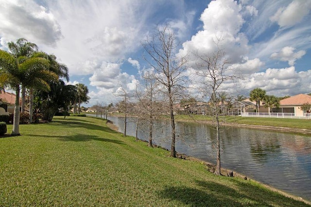 property view of water featuring fence