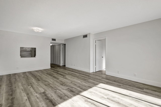 spare room with light hardwood / wood-style flooring