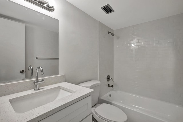 full bathroom with vanity, toilet, and tiled shower / bath combo