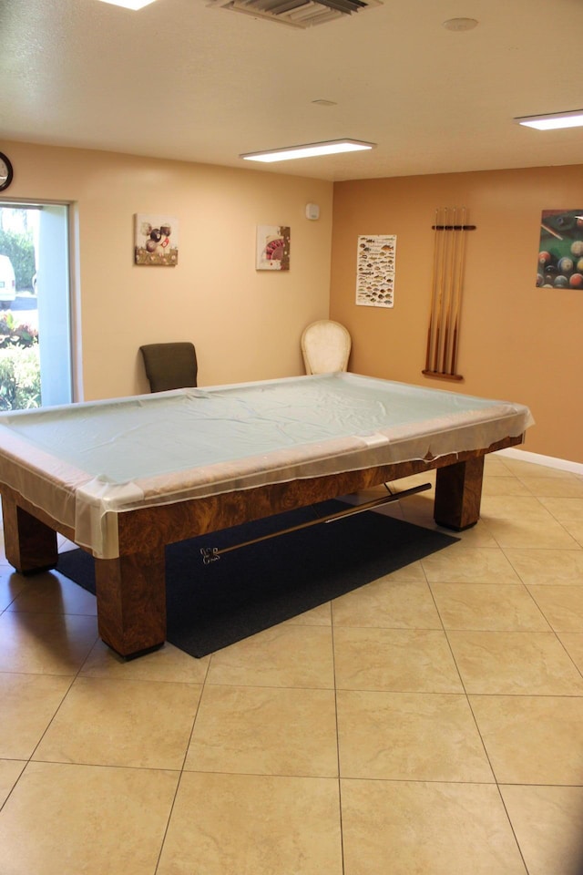 game room with pool table and light tile patterned floors