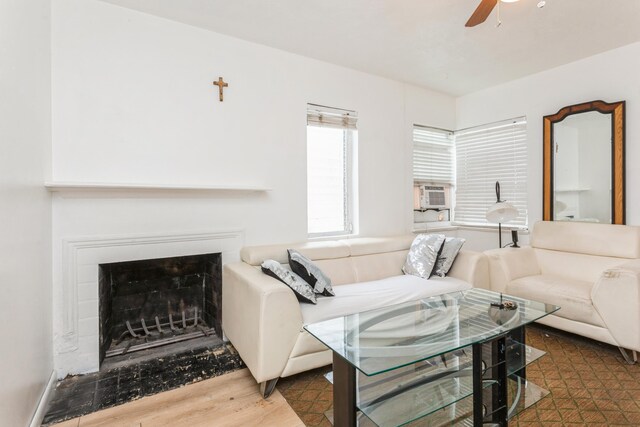 living room featuring cooling unit, ceiling fan, and dark hardwood / wood-style floors